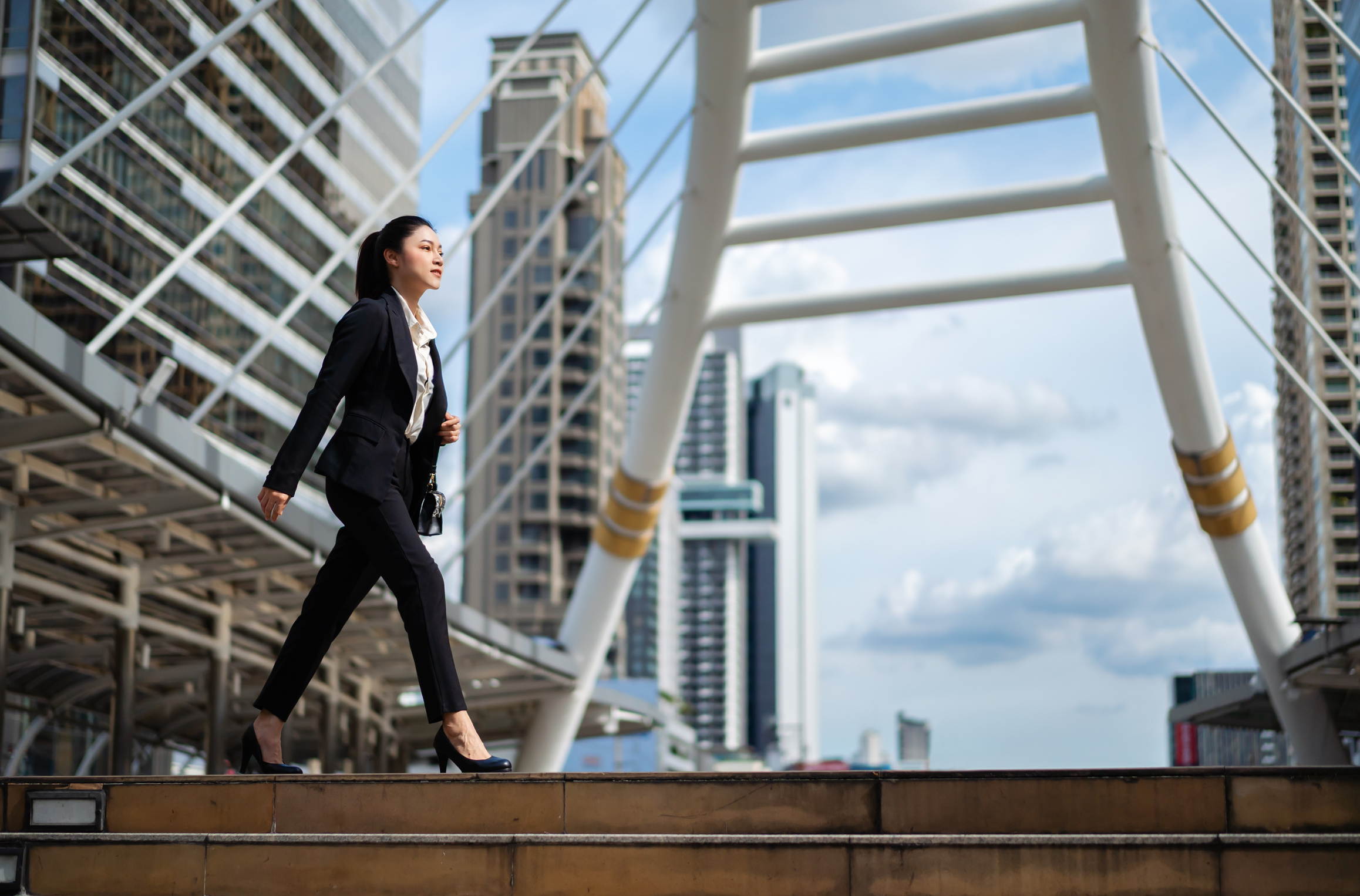 business woman walking in city